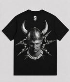 A black short-sleeve t-shirt with a large graphic print on the front showing a man in a horned Viking helmet, lightning bolts, and a silver chain necklace. A small white stylized '9' logo is printed on the inside of the collar. FOOTBALL
